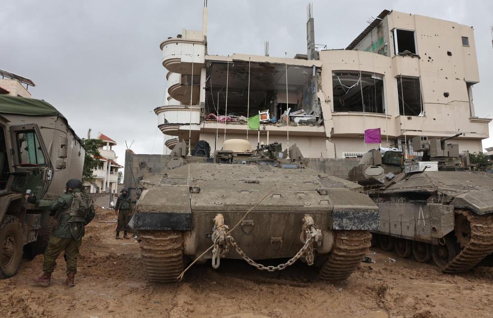 1月11日，以军部队在加沙地带展开行动。新华社发（吉尔·科恩·马根摄）